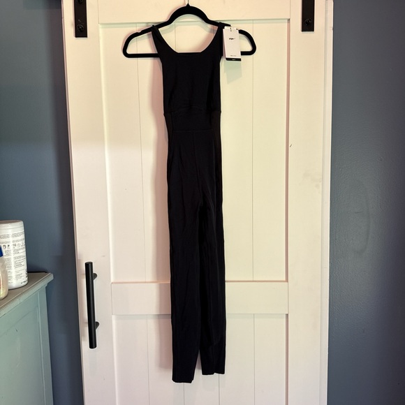 NWT Nike Yoga Size S Black Tight Fit Body Suit - Picture 1 of 3